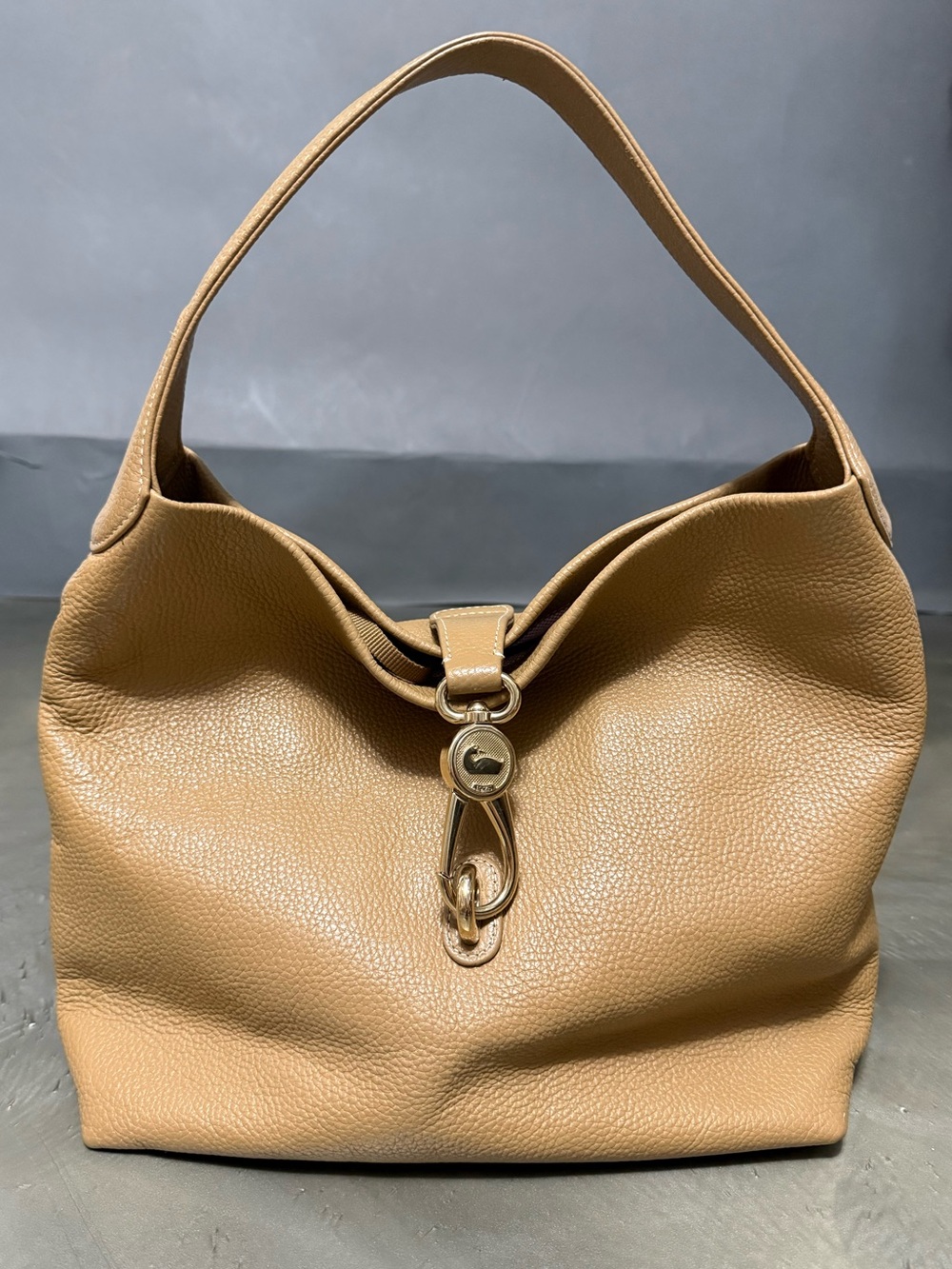 Dooney and Bourke Logo Lock Hobo Bag in Camel Pebbled Leather